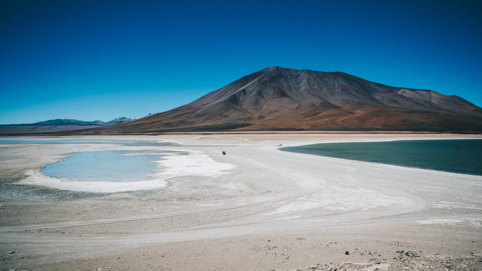 Salt lake and volcano in the Atacama desert